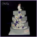 wedding cake with roses and orchids